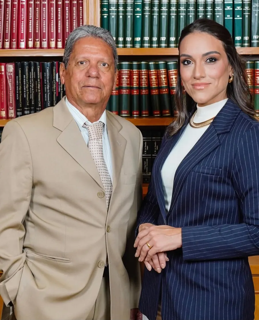 Caroba & Caroba attorneys in front of the law library