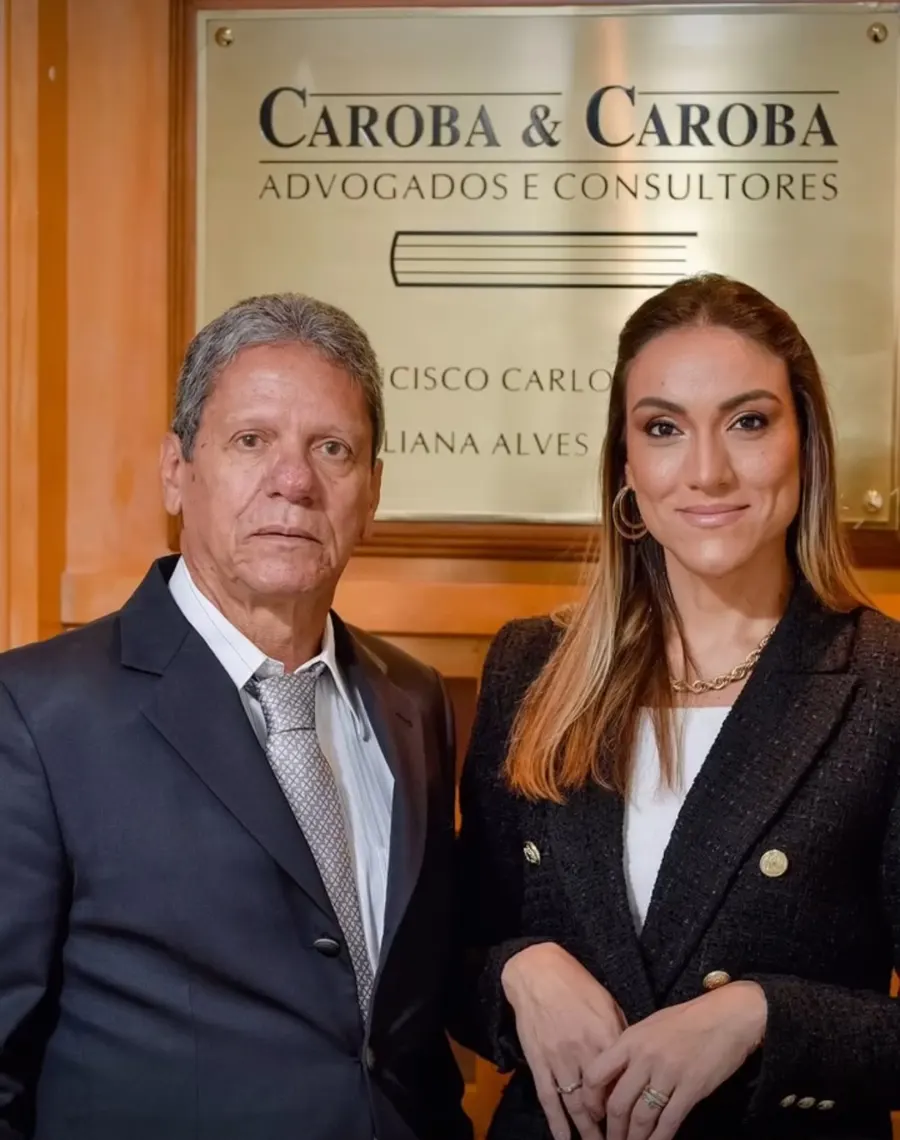 Caroba & Caroba attorneys in front of the firm sign